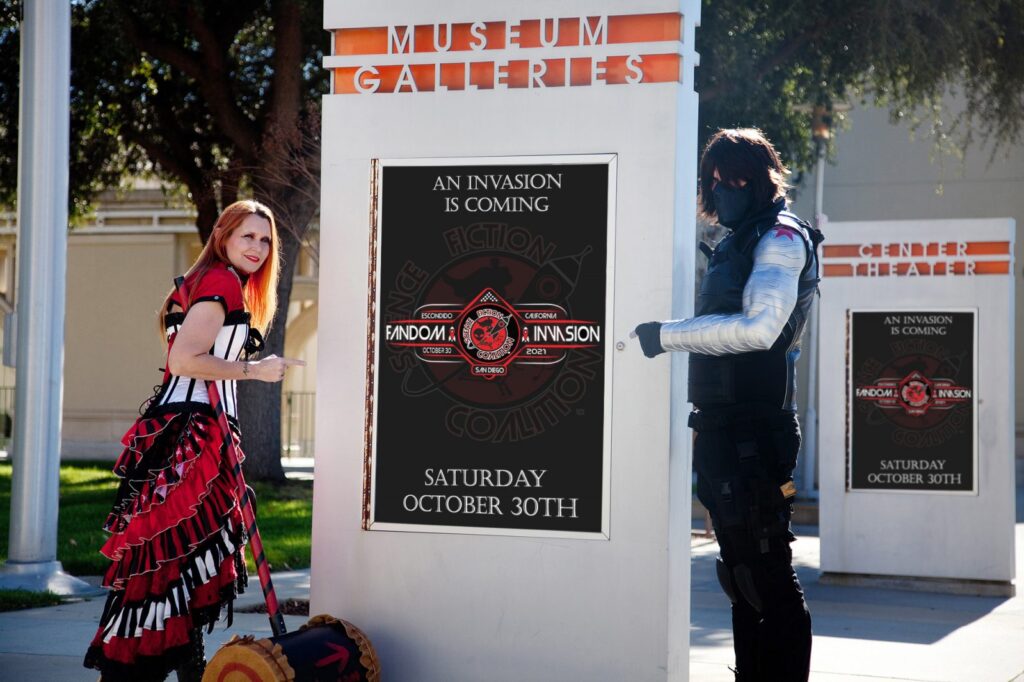 Harley Quinn and Winter Soldier cosplayers pointing to a Fandom Invasion poster